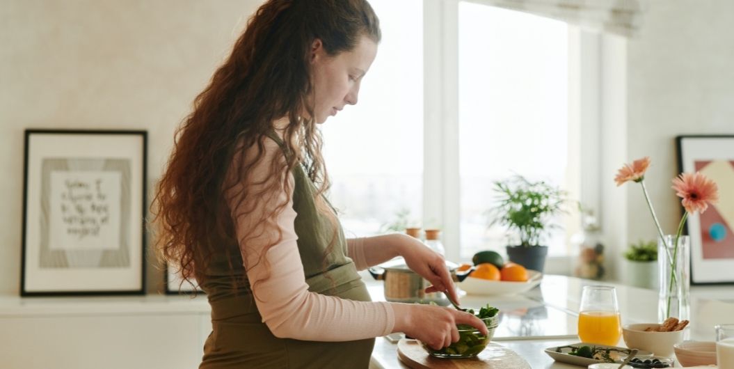 pregnant woman cooking