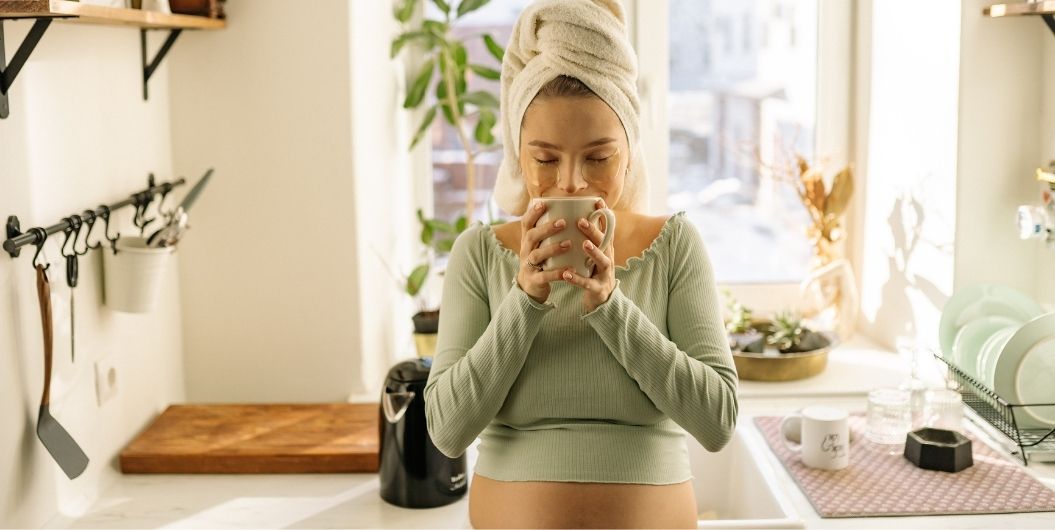 pregnant woman drinking water