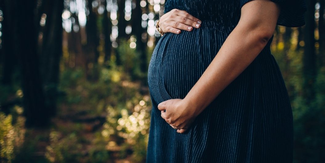 pregnant woman in blue dress