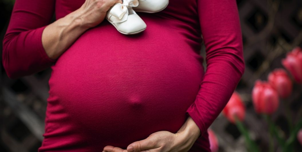 pregnant woman in red dress