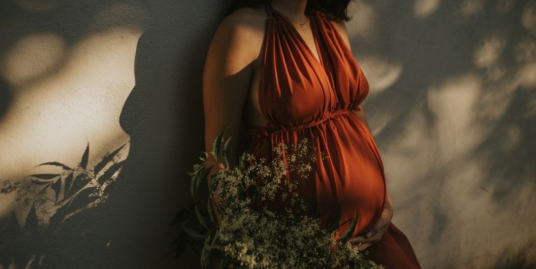 pregnant woman in red dress