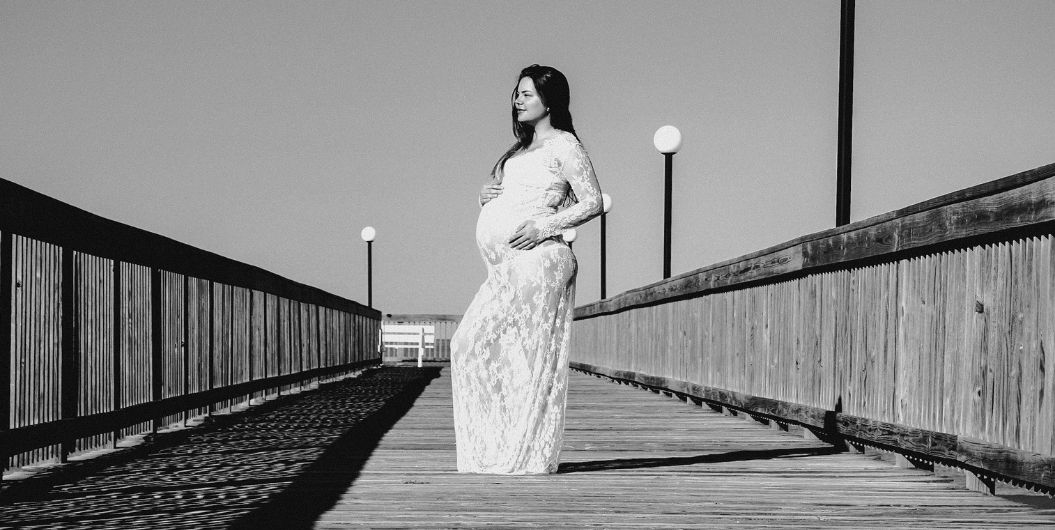 pregnant woman on a bridge