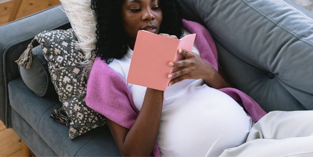 pregnant woman reading a book