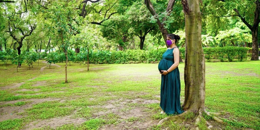 pregnant woman in a green dress