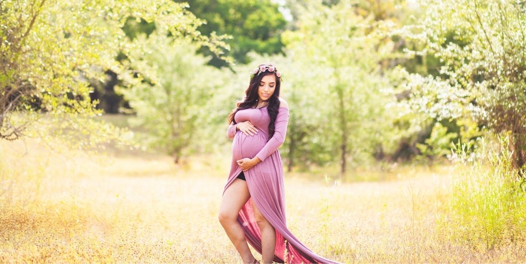 pregnant woman in pink dress