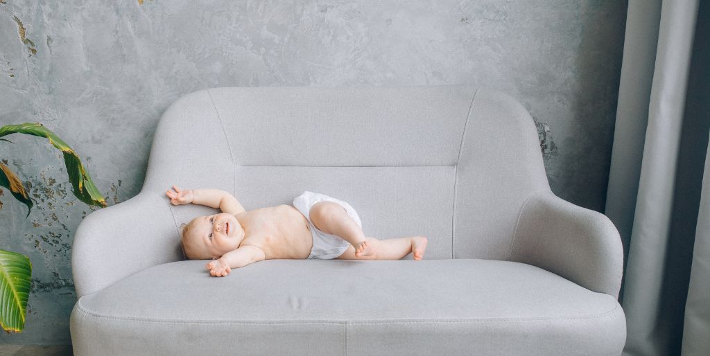 baby lying on a couch